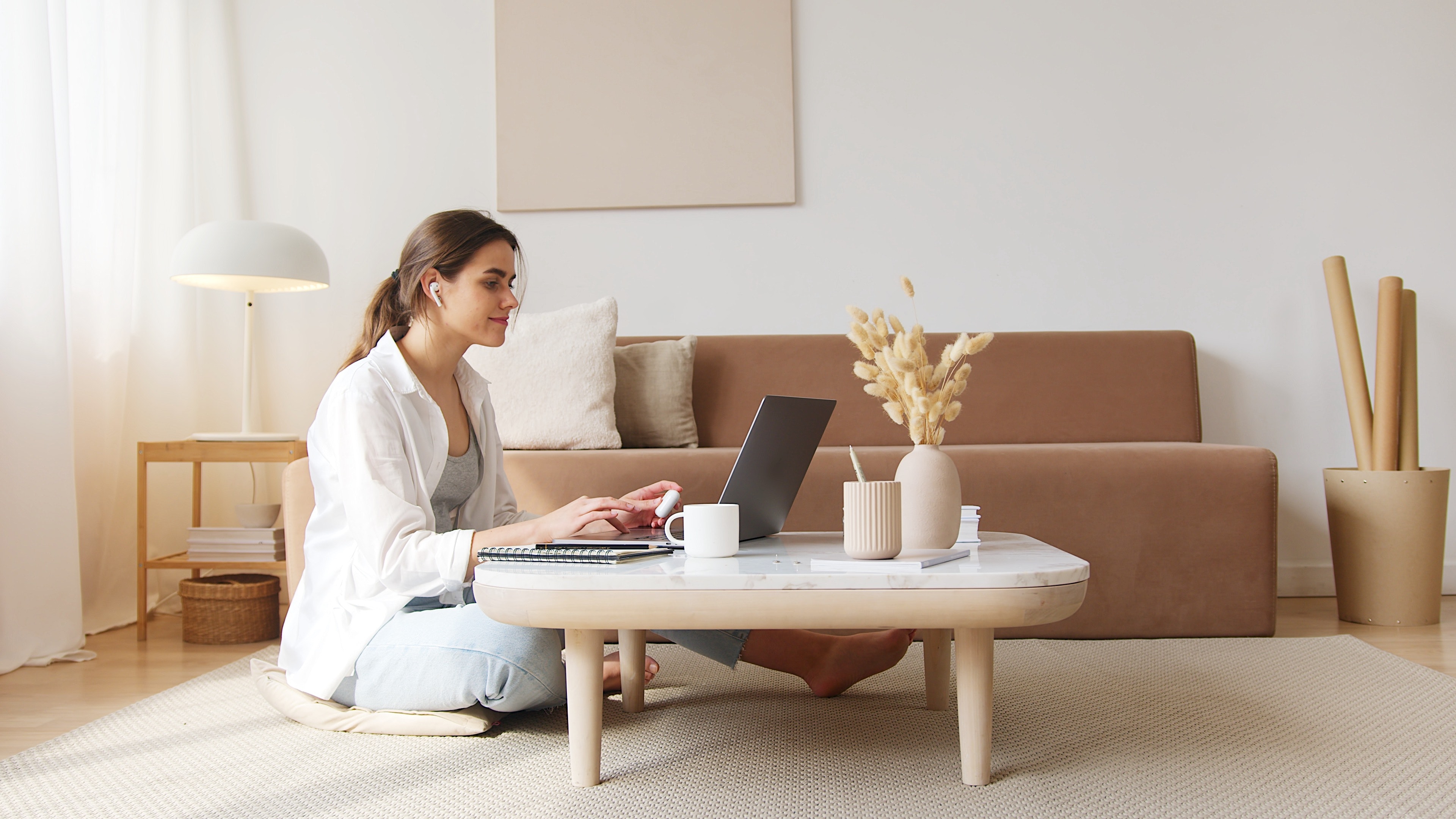 content-woman-using-laptop-on-floor-4492129