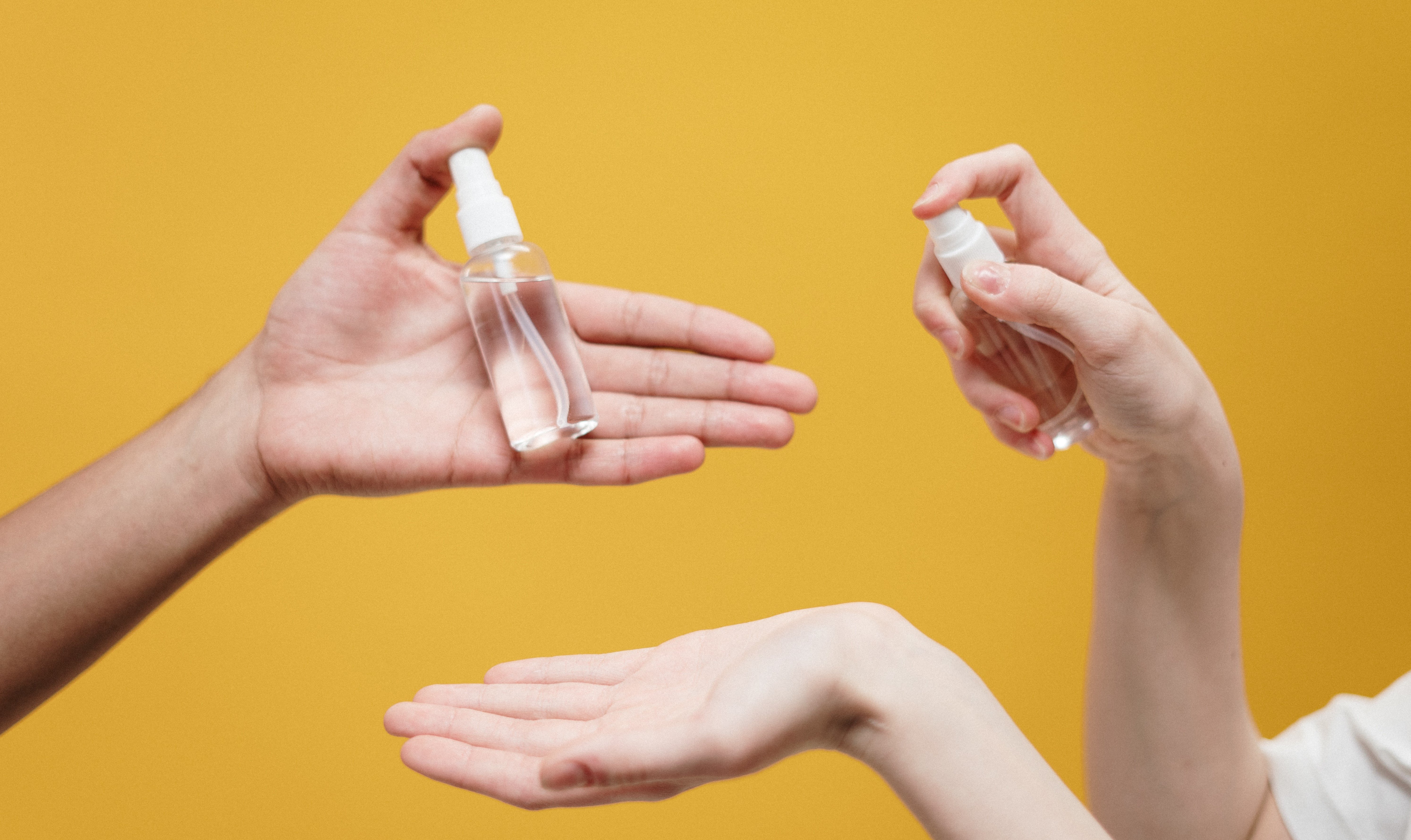 people-holding-clear-glass-bottle-3951862_1